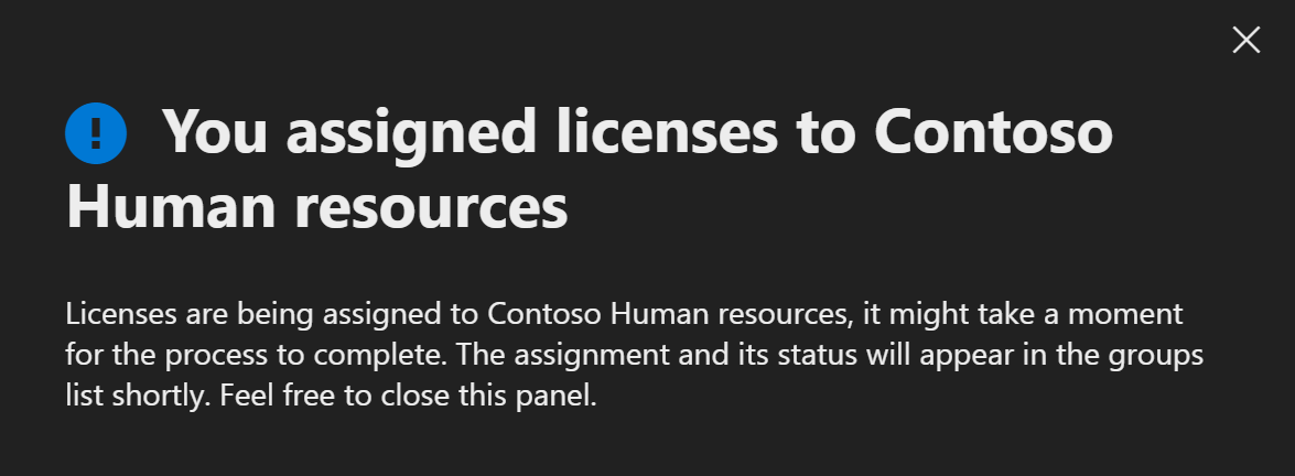 Screenshot of message telling the administrator that they assigned a license to a group.