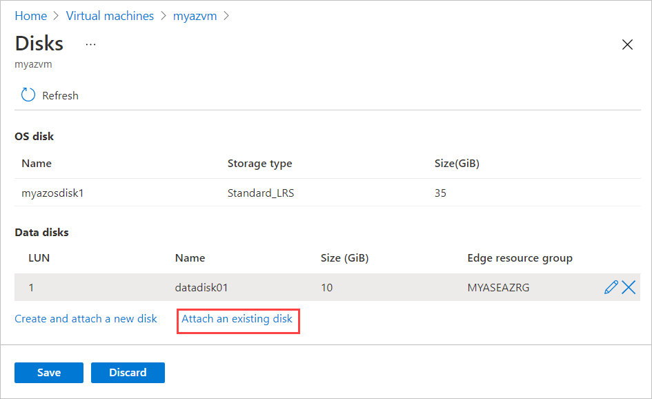 Screenshot of the Disks blade for an Azure Stack Edge virtual machine. The "Attach an existing disk option" is highlighted.