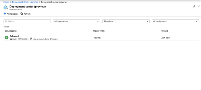 Screenshot shows Deployment center with Release-1 marked with a green check mark icon.