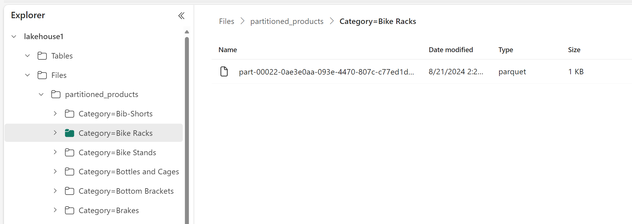 Screen picture of the lakehouse explorer and the product file partitioned by category.