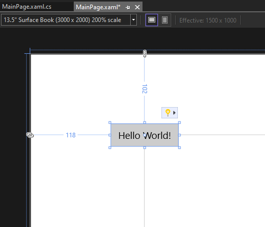 Screenshot showing the Button control on the canvas of the XAML Designer with the label of the button changed to Hello World!