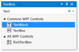 Screenshot della finestra casella degli strumenti con il controllo TextBlock selezionato nell'elenco controlli WPF comuni.