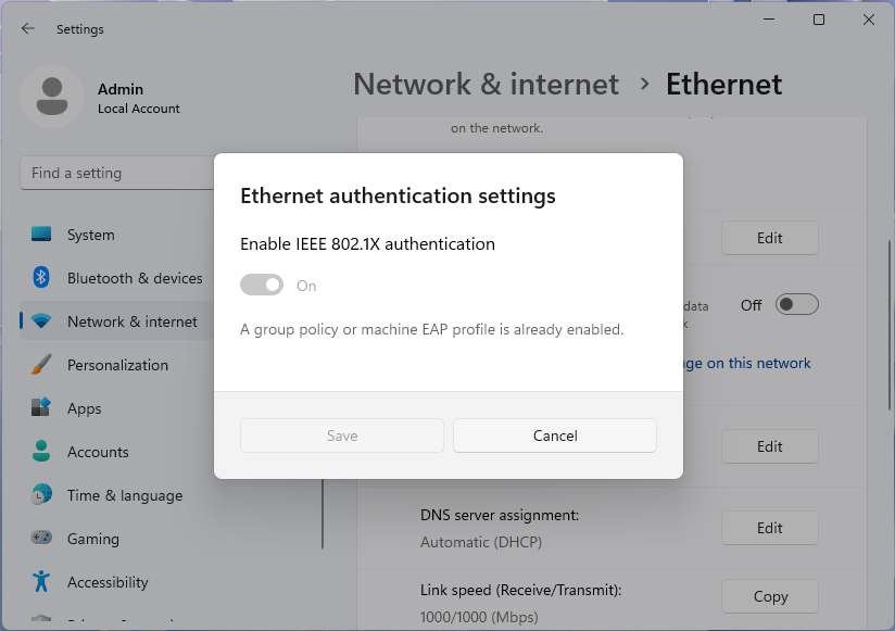 Screenshot della finestra di dialogo Delle impostazioni di autenticazione Ethernet, disabilitata da Criteri di gruppo, nell'app delle impostazioni di Windows 11.