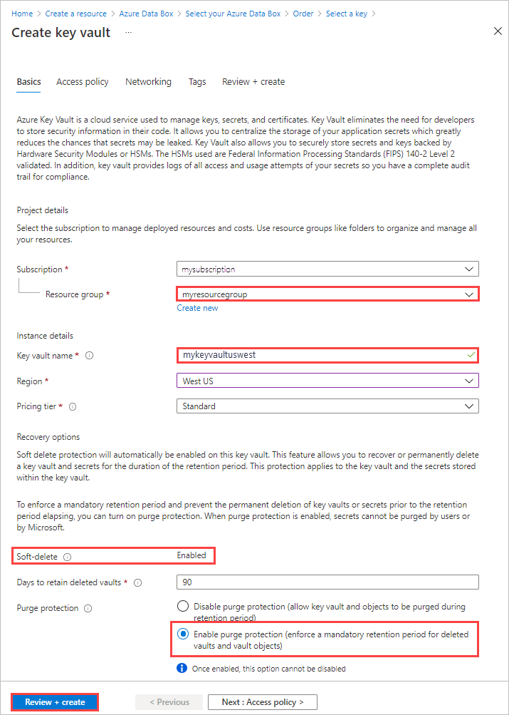 Captura de ecrã do ecrã 'Criar Cofre de Chaves' para uma encomenda do Data Box. O Grupo de Recursos e o Nome do Cofre da Chave são realçados. Soft-Delete e Purge Protection estão ativados.