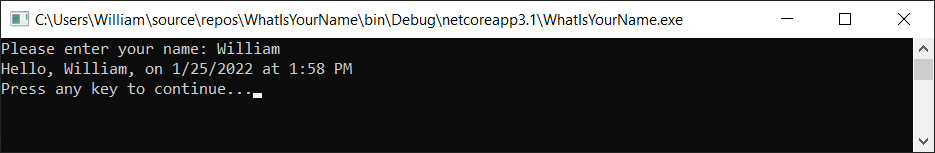 顯示偵錯控制台視窗的螢幕快照，其中包含 [請輸入您的名稱]、日期和時間，以及 [按任意鍵繼續] 訊息。